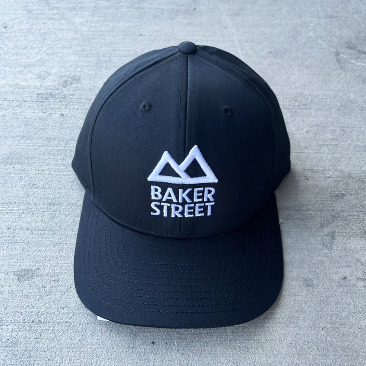 Baker Street Classic Logo Solid Twill Trucker Hat