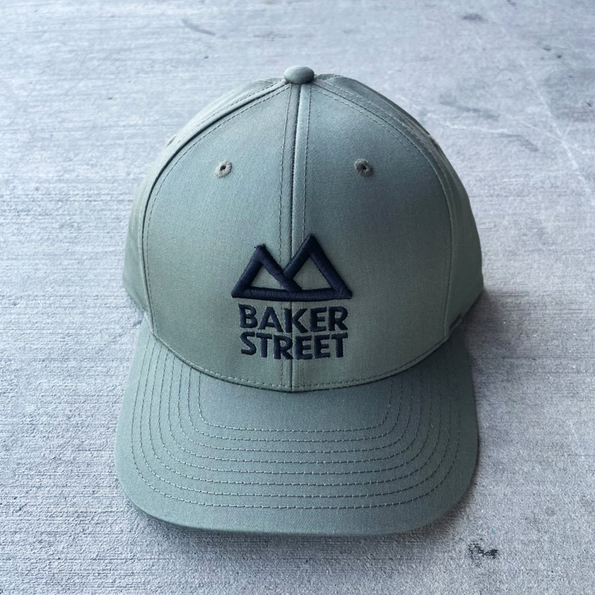Baker Street Classic Logo Solid Twill Trucker Hat