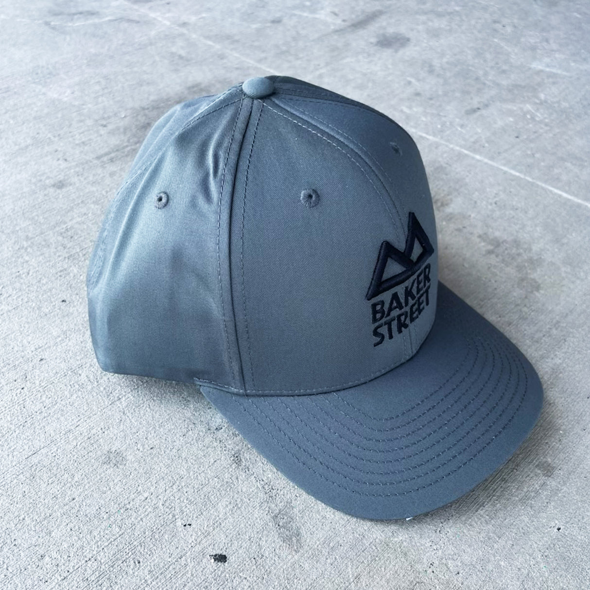 Baker Street Classic Logo Solid Twill Trucker Hat