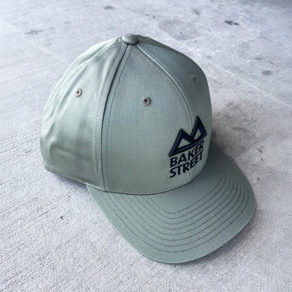 Baker Street Classic Logo Solid Twill Trucker Hat
